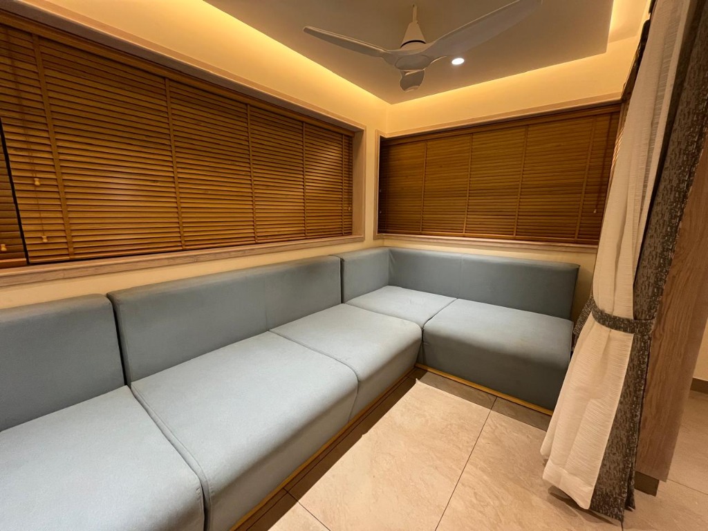 L-Shaped Seating with Wooden Blinds